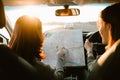 Two young Asia woman friends in car enjoy road trip