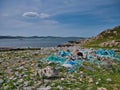 Lost plastic fishing nets and ropes washed up on a remote beach Royalty Free Stock Photo