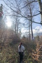 Lost redhead pretty girl in a vegetation forest Royalty Free Stock Photo