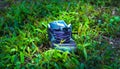 Lost shoe on the green field. Royalty Free Stock Photo