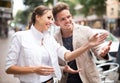 Lost smiling woman asking stranger at the street Royalty Free Stock Photo