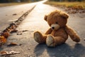 Lost teddy bear, a forlorn sight, awaits its owner on the street