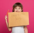 Lost tooth girl portrait, studio shoot on pink background Royalty Free Stock Photo