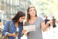 Lost tourists consulting map and phone