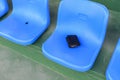 Lost wallet lying on stadium seat Royalty Free Stock Photo