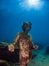 Statue of Dionysus with a crown of ivy in ClaudioÃ¢â¬â¢s Ninfeum. underwater, archeology.