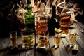 A lot of alcohol, whiskey, tequila, bourbon, brandy, rum on a wooden bar counter, vintage photo