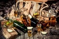 A lot of alcohol, whiskey, tequila, bourbon, brandy, rum on a wooden bar counter, vintage photo