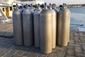 A lot of aluminum scuba diving oxygen tanks standing . Royalty Free Stock Photo