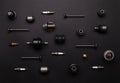 Lot of auto parts: valves, spark plugs, silent blocks, thermostats, filter, and other, lie isolated on a black background