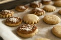 A lot of baked cookies and gingerbread on baking tray, decorated with chocolate and coconut flakes Royalty Free Stock Photo