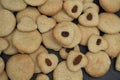 A lot of baked cookies and gingerbread on baking tray, decorated with raisins Royalty Free Stock Photo