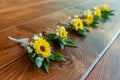 Lot of beautiful pocket flower bouquets made of yellow flowers for a wedding ceremony Royalty Free Stock Photo