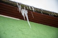 A lot of big beautiful icicle hanging from the roof Royalty Free Stock Photo