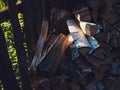 A lot of birch wood is lying by the fence in the sun. Stocks of firewood for the winter for kindling the stove or fireplace. Rural Royalty Free Stock Photo