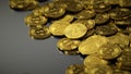 A lot of bitcoin crypto currency gold btc bit coin. Closeup shot of a pile of bitcoin coins isolated on black background.