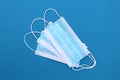 A lot of blue sterile medical masks lie in a pile Royalty Free Stock Photo