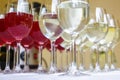 Lot of blurred glasses with red and white wine on the reception party table Royalty Free Stock Photo