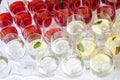 Lot of blurred glasses with red and white wine on the reception party table Royalty Free Stock Photo