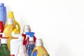 A lot of bottles with chemicals for cleaning. Pile of many colorful bottles on the white background with copy space for text. Royalty Free Stock Photo