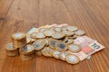 Lot of brazilian coins and bank notes on a wood table Royalty Free Stock Photo