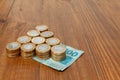 Lot of brazilian coins and bank notes on a wood table Royalty Free Stock Photo