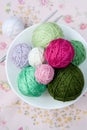 A lot of bright balls of knitting on the background of a flower Royalty Free Stock Photo