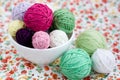 A lot of bright balls of knitting on the background of a flower Royalty Free Stock Photo
