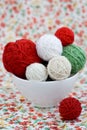 A lot of bright balls of knitting on the background of a flower Royalty Free Stock Photo