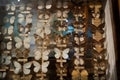 It is a lot of butterflies in the collections of the scientist attached by needles to a white background.