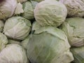 A lot of cabbages, green color, in a market