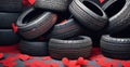 A lot of car tires with red paper hearts.