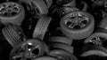 a lot of car wheels piling into a big pile