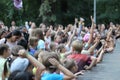Lot of children at the party raise your hands to the stage. Russia, Saratov - august, 2019