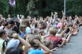 Lot of children at the party raise your hands to the stage. Russia, Saratov - august, 2019 Royalty Free Stock Photo