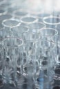 Lot of clean transparent glasses for water and drinks prepared during the event. Royalty Free Stock Photo