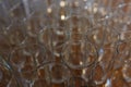 Lot of clean transparent glasses for water and drinks prepared during the event. Royalty Free Stock Photo