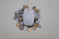 A lot of coins are pressed under one mouse