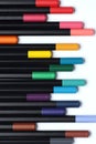 A lot of color pencils next to each other on isolated white background. Royalty Free Stock Photo
