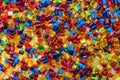 Lot of colored plastic resin granulates Royalty Free Stock Photo