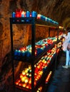 A lot of colorful candles glowing in Covadonga, Asturias, Spain. Religious symbol of the spanish reconquest by King Pelayo