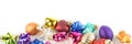 Lot of colorful Christmas balls in the snow as a banner, isolated on a white background Royalty Free Stock Photo