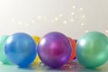 Lot of colorful party baloons against lights bokeh.Empty space for text