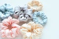 Lot of Colorful silk Scrunchies on white. Flat lay Hairdressing tools and accessories. Hair Scrunchies, Elastic HairBands, Bobble Royalty Free Stock Photo