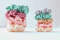 Lot of Colorful silk Scrunchies on white. Luxury Hairdressing tools and accessories. Hair Scrunchies, Elastic HairBands, Bobble