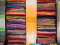 Lot of colorful traditional Moroccan scarves and shawls in a market Royalty Free Stock Photo