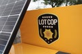 tor, canada - august 18, 2023: lot cop logo sign on side of lot cop machine outside exterior with part of solar 40 p 20