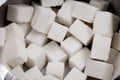 A lot of cubes of white refined sugar in a metal sugar bowl top view Royalty Free Stock Photo