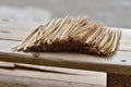 Lot of cut peeled wheat stems in pile ot wooden palette desk. Grain stems prepared for hand made home work. Decoration making Royalty Free Stock Photo