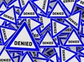 A lot of denied on blue triangle road sign Royalty Free Stock Photo